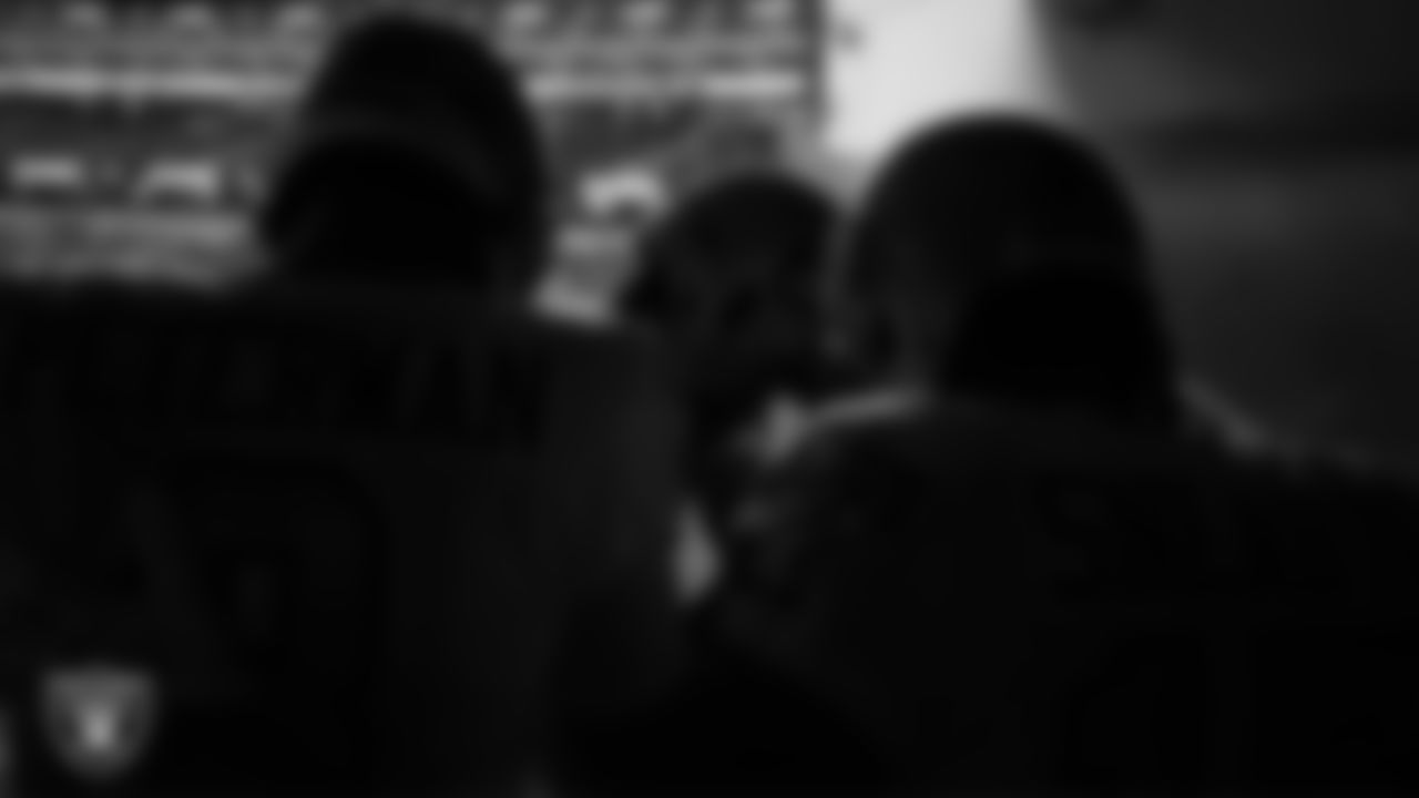 The Las Vegas Raiders' quarterbacks huddle in the tunnel before the regular season away game against the Los Angeles Chargers.