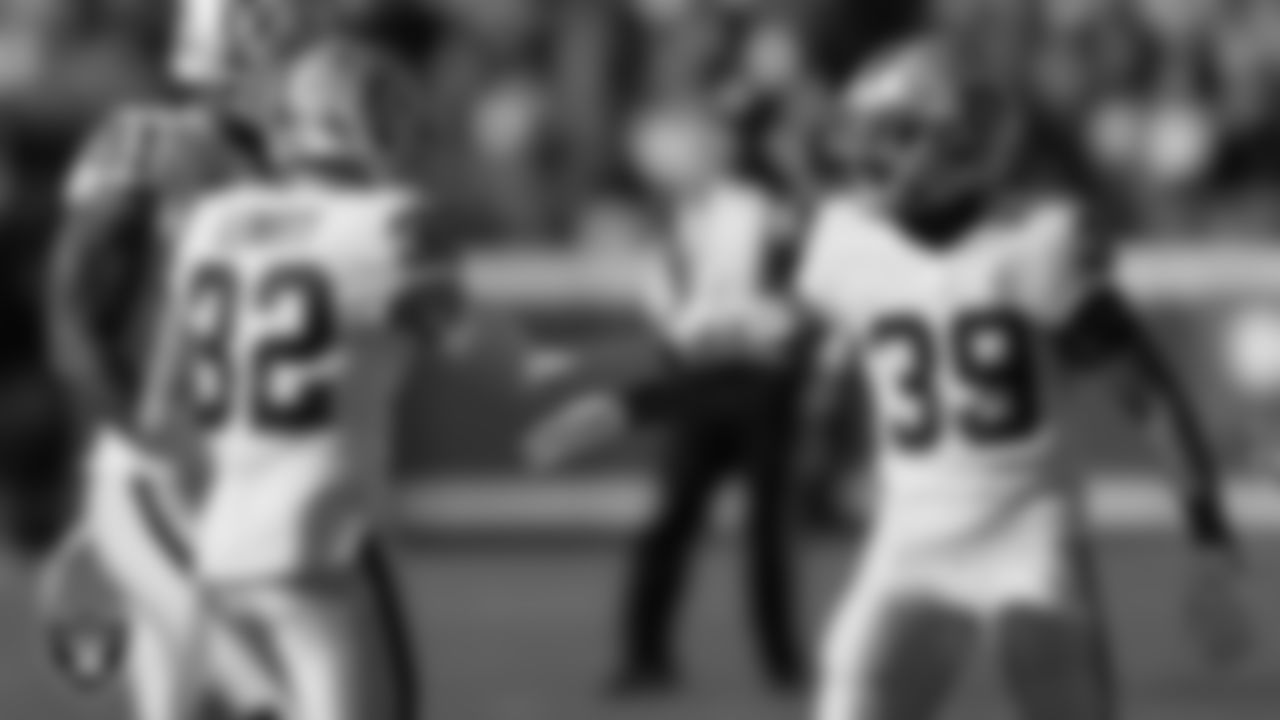 Las Vegas Raiders safety Dallin Leavitt (32) and cornerback Nate Hobbs (39) during the regular season away game against the Kansas City Chiefs.