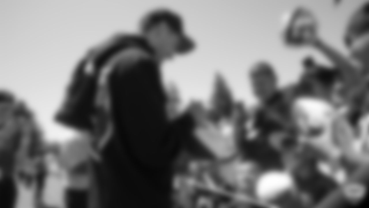 Rapper and Bay Area native G-Eazy signs autographs for fans after practice at 2019 Training Camp.