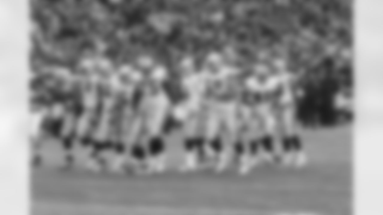 The offense breaks the huddle and steps up to the line of scrimmage.
