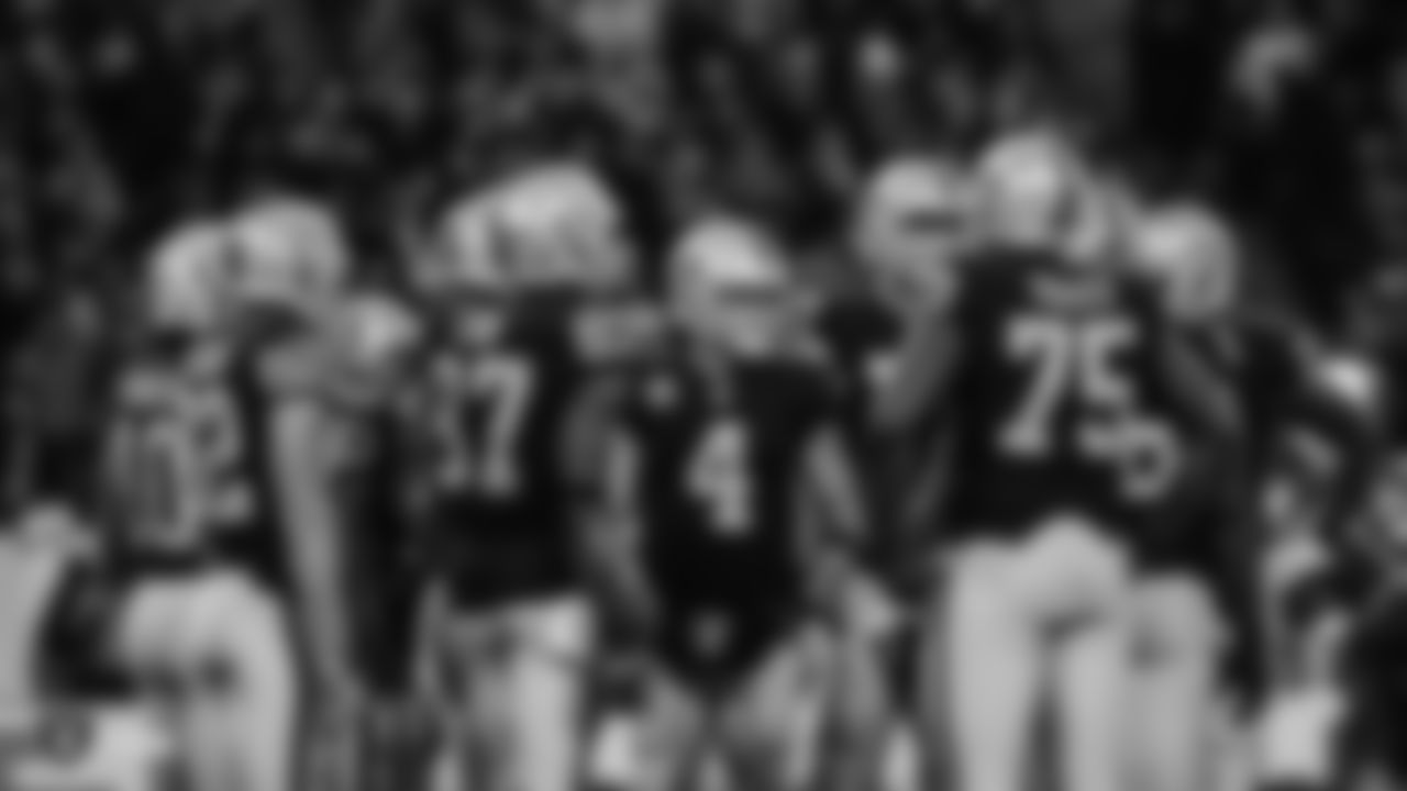 Oakland Raiders quarterback Derek Carr (4) in the huddle during the Oakland Raiders regular season game against the Seattle Seahawks at Wembley stadium on October 14th, 2018, in London, United Kingdom. The Oakland Raiders lost 27-3.