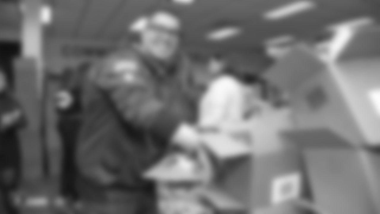 Oakland Raiders linebacker Kyle Wilber (58), tight end Paul Butler (84), tackle Jamar McGloster (64), defensive tackle Clinton McDonald (97), linebacker Shilique Calhoun (91), long snapper Andrew DePaola (48), the Raiderettes, and the Raiders Front Office in Alameda build care packages for victims of the Norther California Fires, Tuesday, November 20, 2018, in Alameda, California.