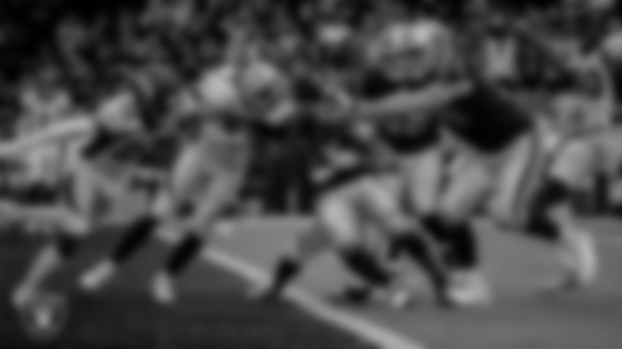 Las Vegas Raiders running back Josh Jacobs (28) rushes for a 10-yard touchdown during the regular season home game against the Denver Broncos at Allegiant Stadium.
