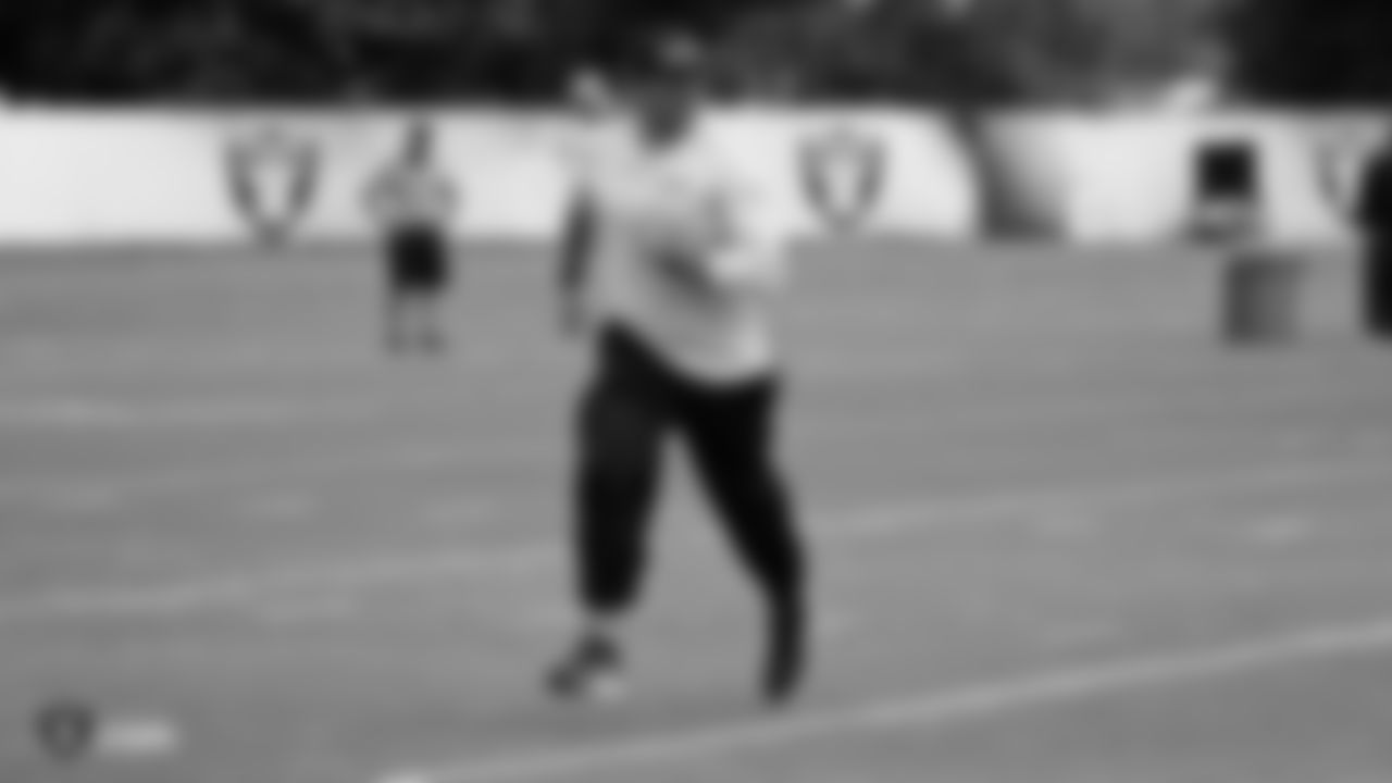 Raiders tight ends coach Frank Smith on the field for practice.