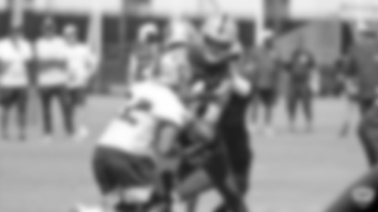 Raiders running back Doug Martin (22) and quarterback Derek Carr (4) on the field for practice at 2019 Training Camp.