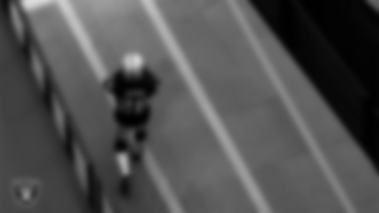 Las Vegas Raiders running back Josh Jacobs (28) walks down the tunnel before the regular season home game against the Denver Broncos.