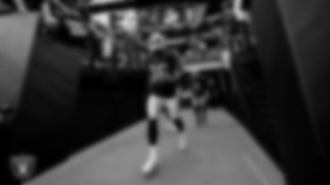 Las Vegas Raiders running back Trey Ragas (36) walks down the tunnel before the regular season home game against the Miami Dolphins .