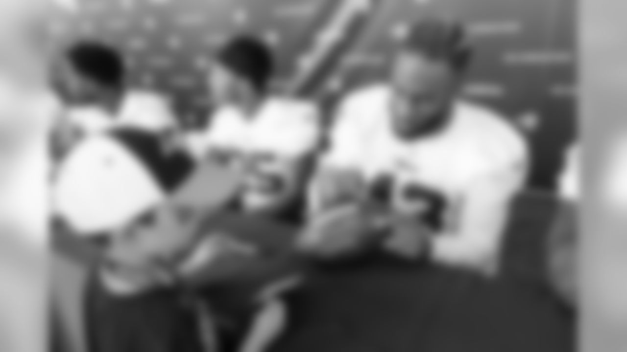 Safety (43) John Johnson III of the Los Angeles Rams signs autographs during Day 3 of Training Camp, Saturday, July 28, 2018, in Irvine, CA. (Will Navarro/Rams)