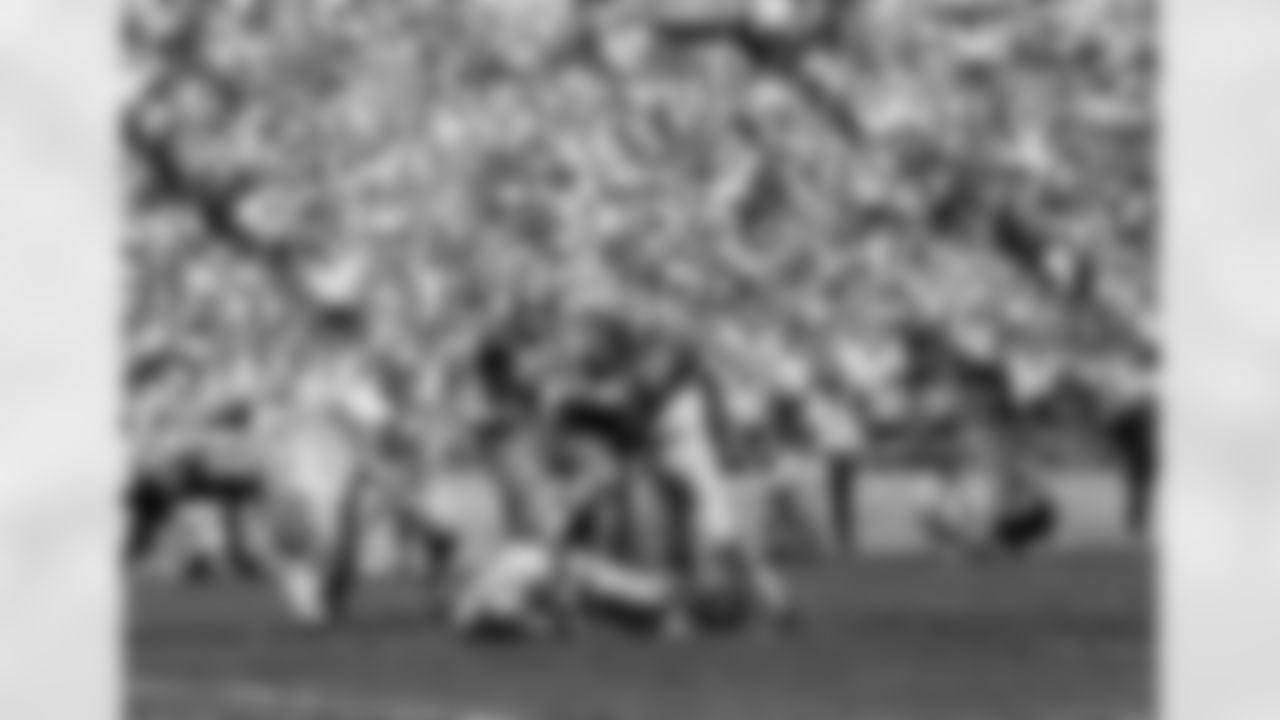 Los Angeles Rams running back Dick Bass (22) skirts the line pile up as he rushes for the end zone and a Ram touchdown in the second quarter at San Francisco?s Kezar stadium on Nov. 5, 1967. In foreground is Rams end Billy Truax (87). Identifiable 49ers include Ed Beard (50), Roland Lakes (60) and Frank Nunley (57). (AP Photo)