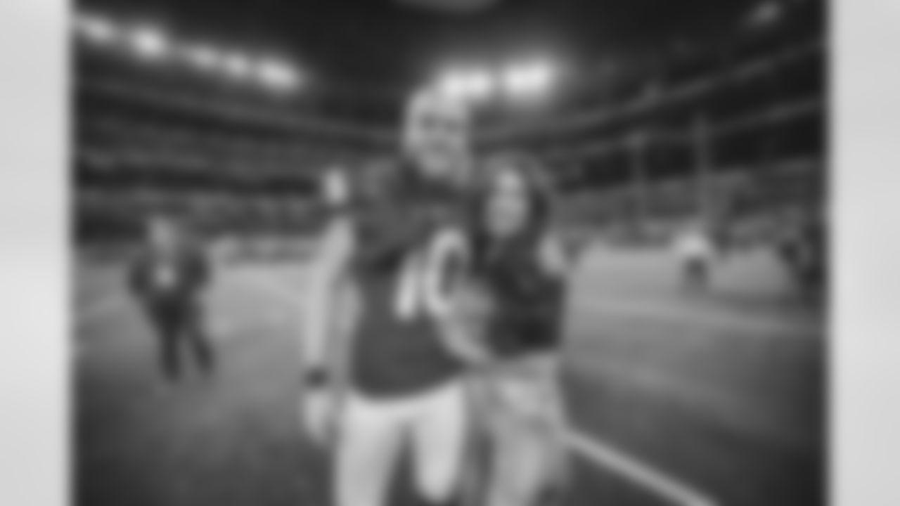 Wide Receiver (10) Cooper Kupp of the Los Angeles Rams celebrates with his wife after the Rams defeat the San Francisco 49ers to win the NFC Championship Game 20-17, Sunday, January 30, 2022, in Inglewood, CA. The Rams won 20-17. (Jeff Lewis/LA Rams)