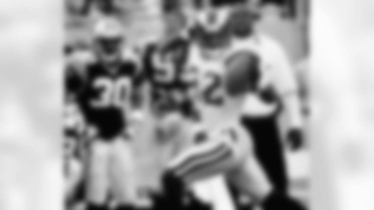 St. Louis Rams' Dre Bly (32) celebrates as he gallops past the Carolina Panthers' bench into the end zone after intercepting a pass in the Rams' 34-21 win at Ericsson Stadium in Charlotte, N.C., Sunday, Dec. 5, 1999. Bly's 53-yard touchdown sealed the game for the Rams. (AP Photo/Rick Havner)