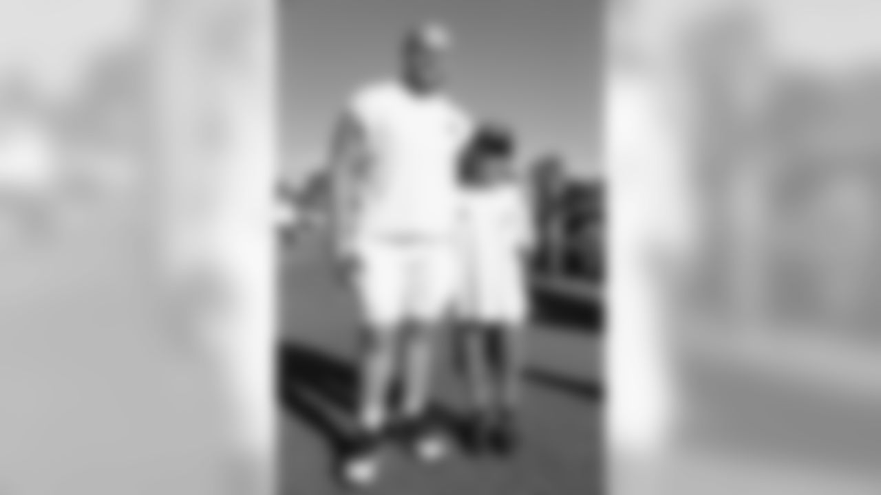 Center (55) Brian Allen of the Los Angeles Rams takes a photo with fans during Day 6 of Training Camp, Wednesday, August 01, 2018, in Irvine, CA. (Will Navarro/Rams)