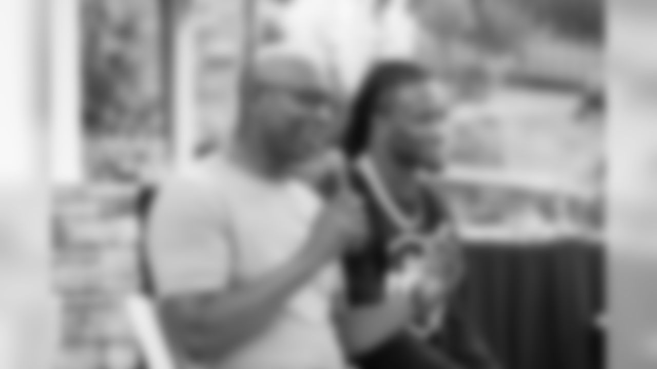 HOF running back Eric Dickerson and (30) Todd Gurley of the Los Angeles Rams speak to the rookies at a BBQ/Social at Eric Dickerson's home, Tuesday, June 11, 2019, in Calabasas, CA. (Jeff Lewis/Rams)