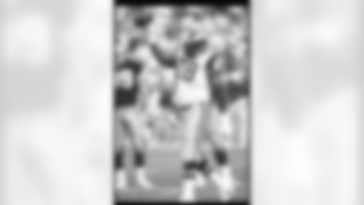 28 Nov 1993: Offensive lineman Jackie Slater of the Los Angeles Rams celebrates with his game ball for setting an NFL record for most games played by an offensive lineman. Slater was awarded the ball during a game against the San Francisco 49ers at Cand