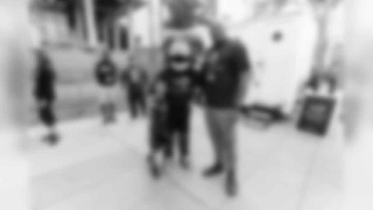 Offensive tackle (77) pose for a photo with his son and Rams Rampage, as the Rams are proud the lead in the United Way HomeWalk 2019 and 5K family run/walk to raise public awareness and funds to end homelessness. Joined by Rams volunteers, Rams Rampage, L.A. Cheerleaders, and proud partnered sponsors and local organizations. Saturday, May 18th, 2019, Los Angeles, CA. (Will Navarro/Rams)