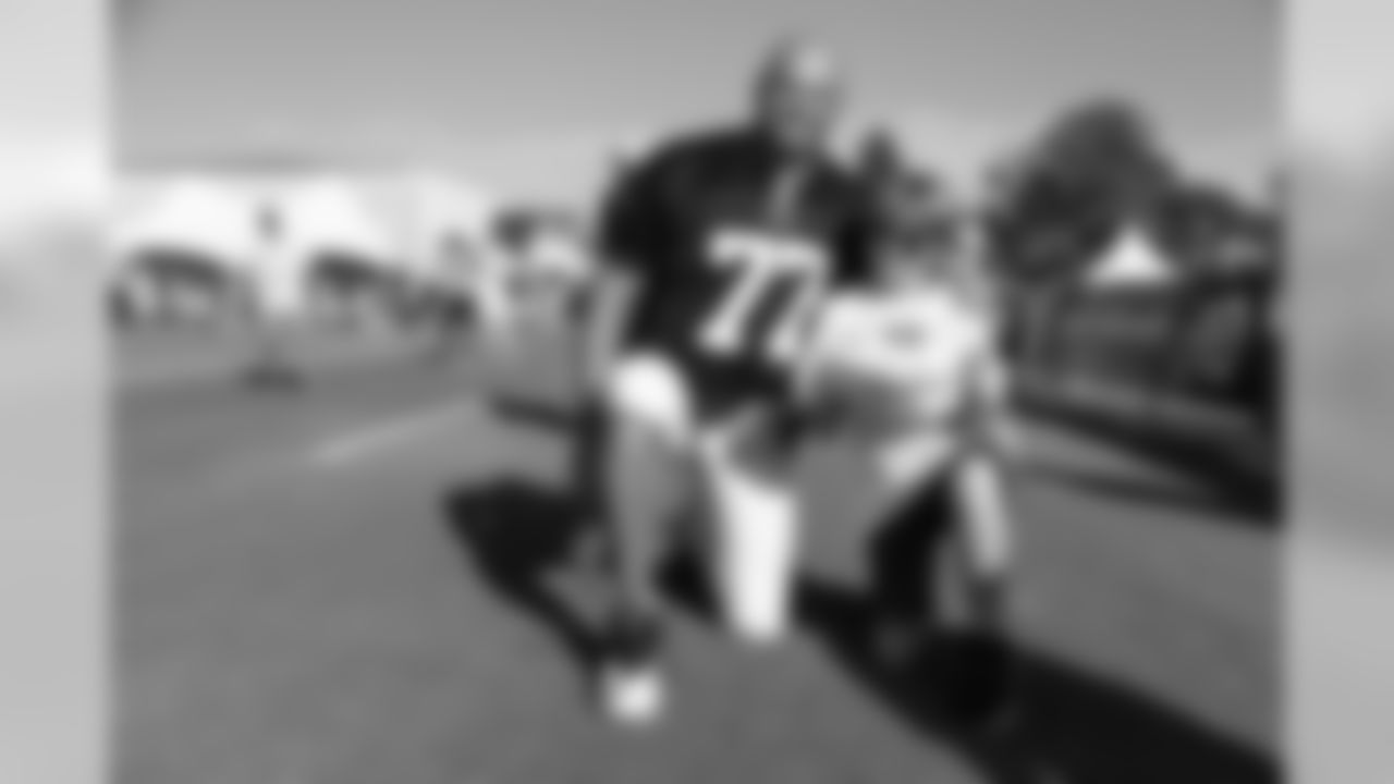 Offensive tackle (77) Andrew Whitworth of the Los Angeles Rams takes a photo with fans during Day 6 of Training Camp, Wednesday, August 01, 2018, in Irvine, CA. (Will Navarro/Rams)