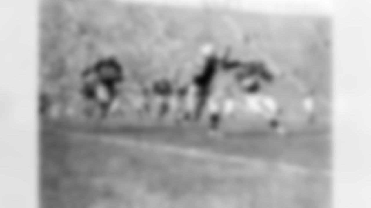 Jack Butler of the Pittsburgh Steelers (80) tries to stop an unidentified L.A. Rams' player while Pittsburgh Steelers back him up during their game at Los Angeles, Oct. 2, 1955. Steelers are Dale Dodrill (60), John Reger (50), Dick Modzelewski (79), and Rams' John Hock. (Vic Stein via AP)