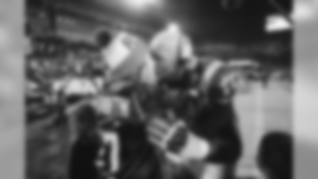 Los Angeles Rams offensive tackle Andrew Whitworth (77) celebrates with his family following an NFL Divisional playoff game win against the Dallas Cowboys on January 12th, 2019at the Memorial Coliseum in Los Angeles, Calif. (Hiro Ueno/Rams)