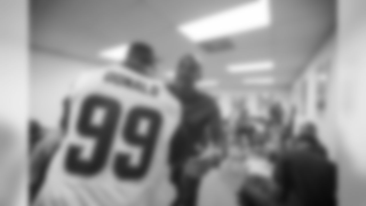 Defensive tackle (99) Aaron Donald of the Los Angeles Rams hands a check for $10,000 to the Brotherhood Crusade, Tuesday, October 22, 2018, in Los Angeles, CA. (Jeff Lewis)