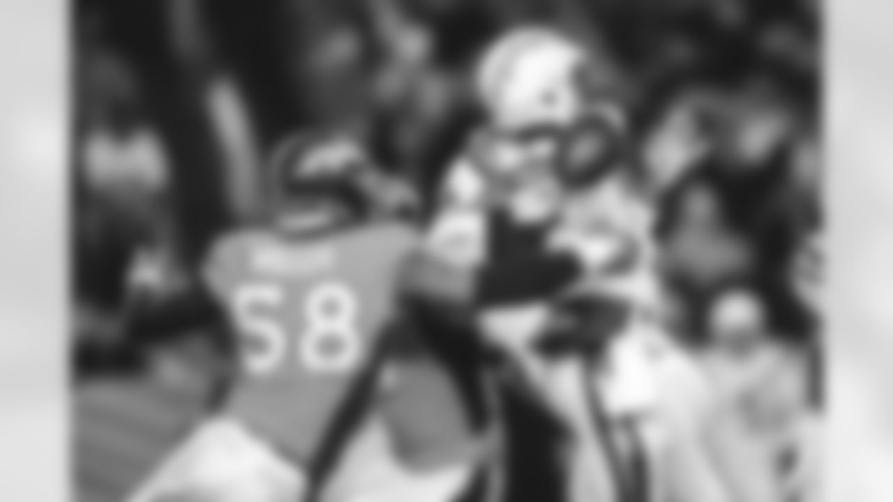 Denver Broncos outside linebacker Von Miller hits Los Angeles Chargers quarterback Geno Smith during the second half of an NFL football game, Sunday, Dec. 30, 2018, in Denver. (AP Photo/Jack Dempsey)