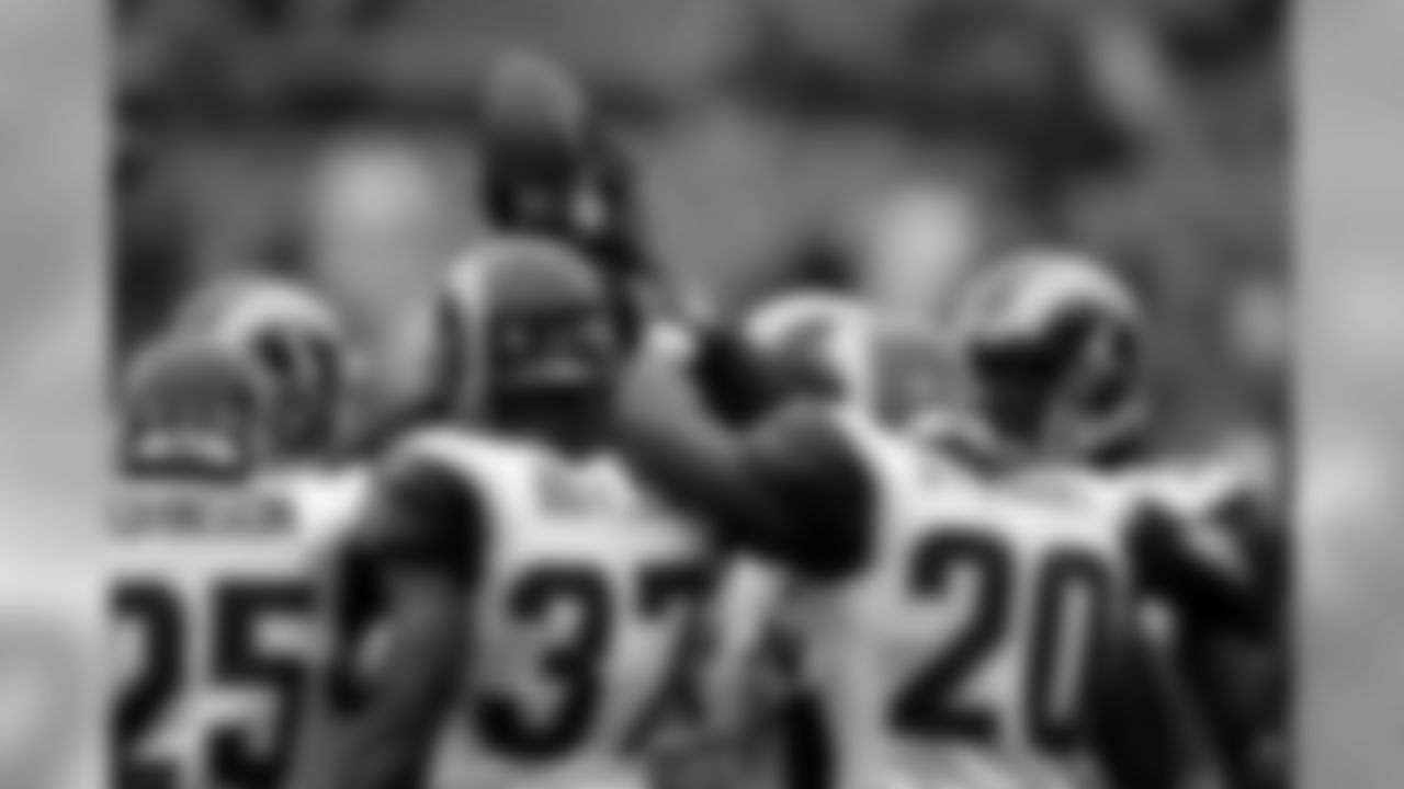 Members of the St. Louis Rams gather around the football during a NFL football game against the Oakland Raiders, Sunday, September 19, 2010 in Oakland. The Raiders won the game 16-14. (AP Photo/Paul Jasienski)