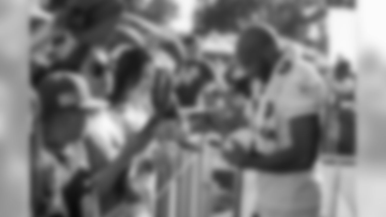 Cornerback (21) Aqib Talib of the Los Angeles Rams signs autographs after practice on Day 2 of Training Camp, Friday, July 27, 2018, in Irvine, CA. (Jeff Lewis/Rams)