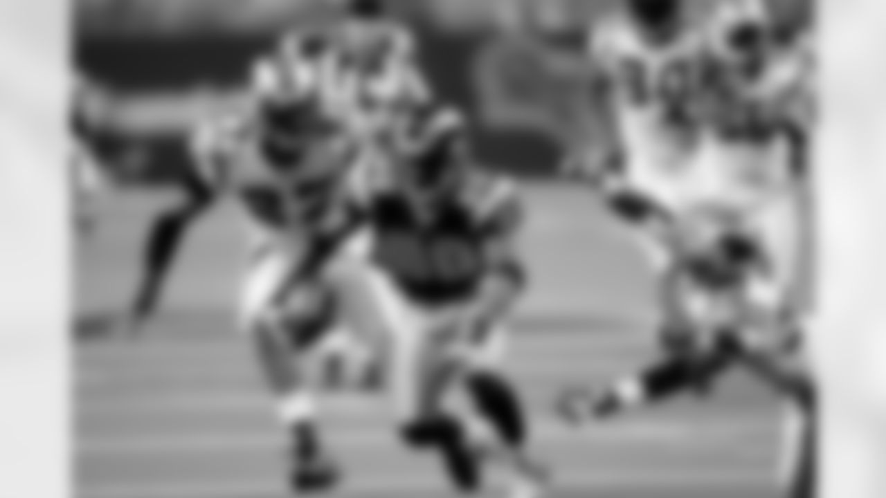 St. Louis Rams wide receiver Isaac Bruce (80) runs upfield with a reception during an NFC Divisional Playoff Game against the Carolina Panthers. The Panthers defeated the Rams 29-23 in overtime on January 10, 2004 in St. Louis, Missouri. (AP Photo/Kevin Terrell)