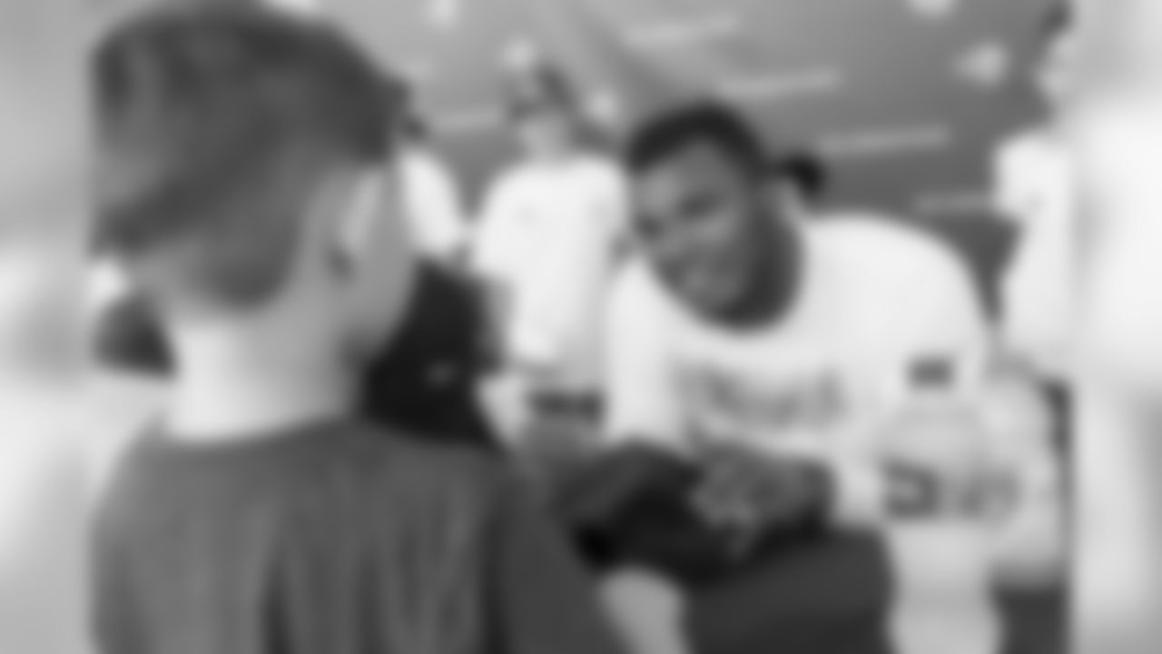 Defensive end (57) John Franklin-Myers of the Los Angeles Rams signs autographs during Day 5 of Training Camp, Monday, July 30, 2018, in Irvine, CA. (Will Navarro/Rams)