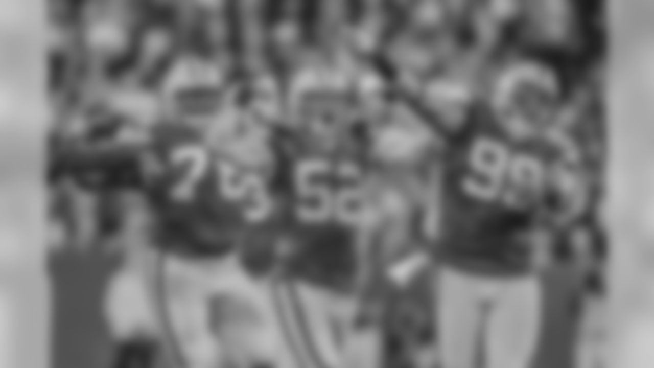 Green Bay Packers' Clay Matthews (52) celebrates his sack of Chicago Bears quarterback Jay Cutler with teammates Jerel Worthy (99) and Mike Daniels (76) during the first half of an NFL football game Thursday, Sept. 13, 2012, in Green Bay, Wis. (AP Photo/Jeffrey Phelps)