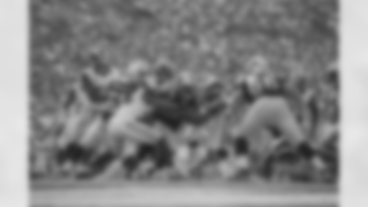 (26) Mark Barron and (25) T.J. McDonald of the Los Angeles Rams make a tackle against the Carolina Panthers during the Rams 13-10 loss to the Panthers in an NFL Week 9 football game, Sunday, November 6, 2016, in Los Angeles, CA. (Jeff Lewis/Rams)