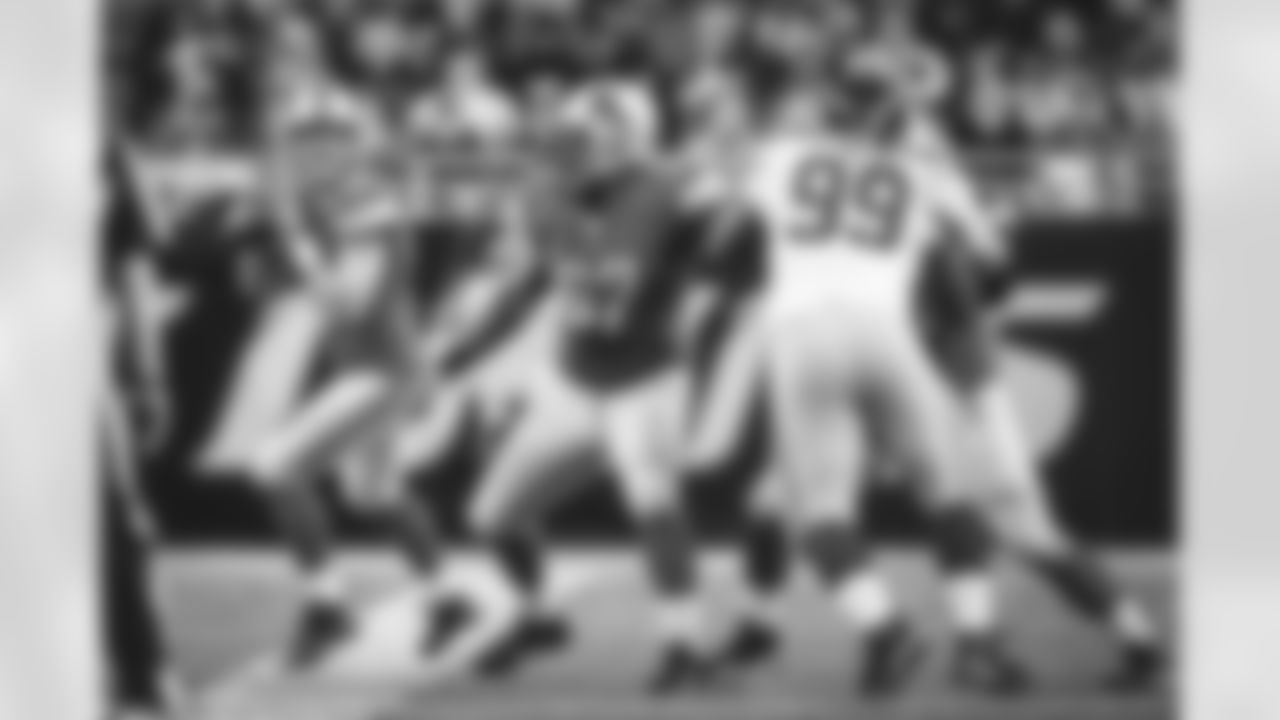 Detroit Lions quarterback Matthew Stafford (9) drops back to pass against the New York Giants during an NFL football game at Ford Field in Detroit, Sunday, Dec. 22, 2013. (AP Photo/Rick Osentoski)