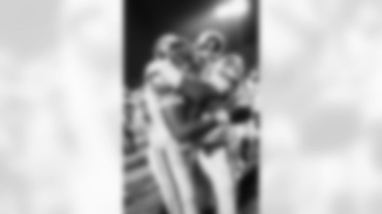 Jackie Salter (78) and Fred Dryer (89) of the Los Angeles Rams embrace after they defeated the Tampa Bay Bucs on Sunday Jan. 7, 1980 in Tampa in their NFC championship contest, 9-0. The Rams will meet the Pittsburgh Steelers on January 20 in the Super Bowl. (AP Photo)