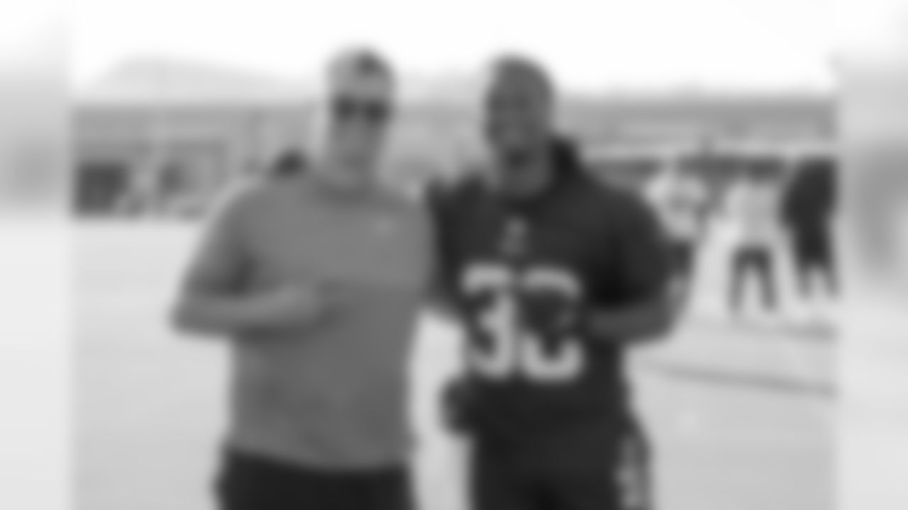 Joc Peterson of the Los Angeles Dodgers speaks to running back (30) Todd Gurley of the Los Angeles Rams during practice, Wednesday, November 6, 2019, in Thousand Oaks, CA. (Jeff Lewis/Rams)