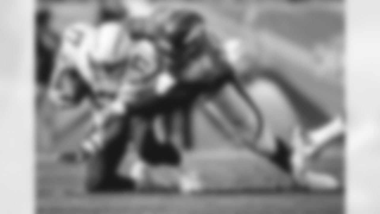 FILE - In this Oct. 30, 2016, file photo, San Diego Chargers quarterback Philip Rivers (17) is sacked by Denver Broncos outside linebacker Von Miller (58) during an NFL football game in Denver. Rivers feels Von Miller's pain. Three years ago, it was Rivers leading the Chargers into the finale of a failed season, playing for pride and facing a talent-laden Broncos team that was jockeying for playoff position. (AP Photo/Joe Mahoney, File)