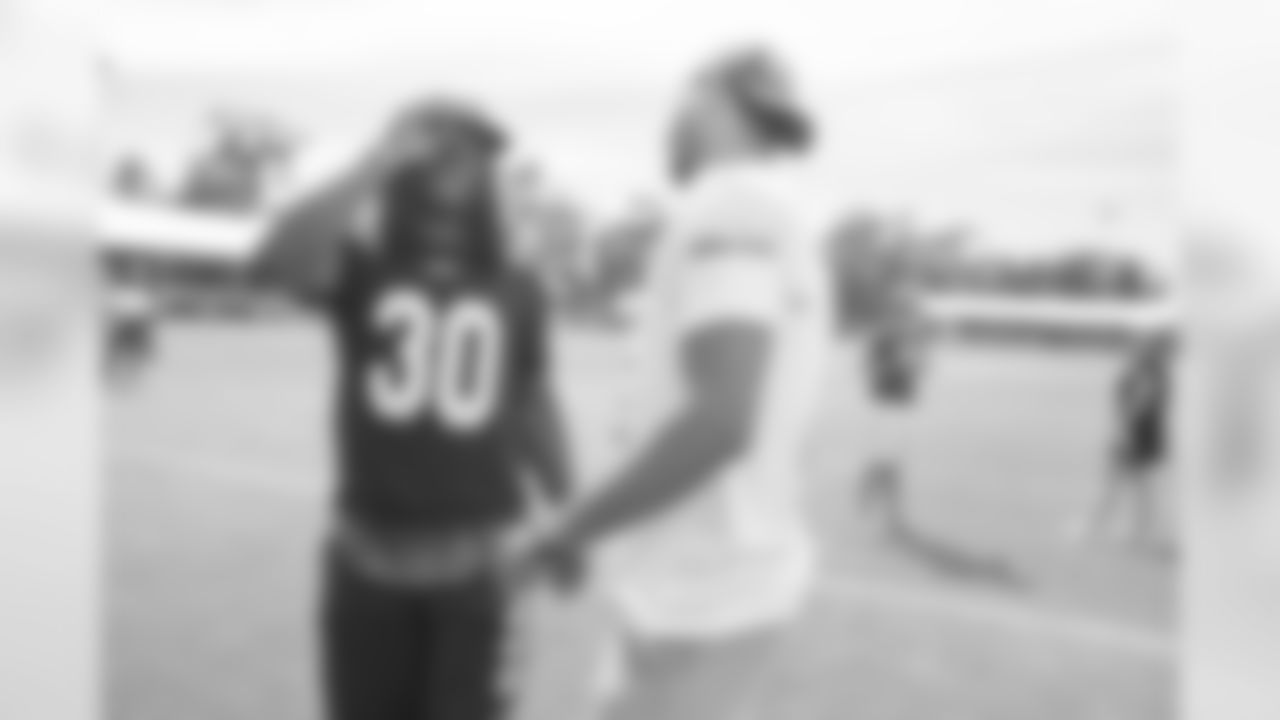 Running back (30) Todd Gurley of the Los Angeles Rams speaks to Josh Hart after practice on day 8 of Training Camp, Sunday, August 4, 2019, in Irvine, CA. (Jeff Lewis/Rams)
