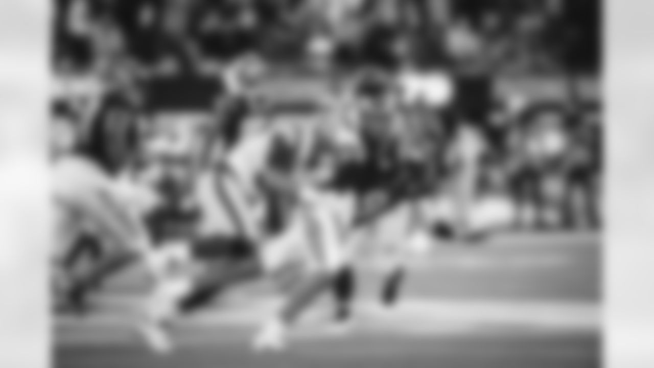 Defensive lineman (99) Aaron Donald of the Los Angeles Rams tackles quarterback (9) Joe Burrow of the Cincinnati Bengals forcing an incomplete pass late in the game on 4th down during Super Bowl LVI, February 13, 2022, in Inglewood, CA. The Rams won 23-20. (Jeff Lewis/LA Rams)