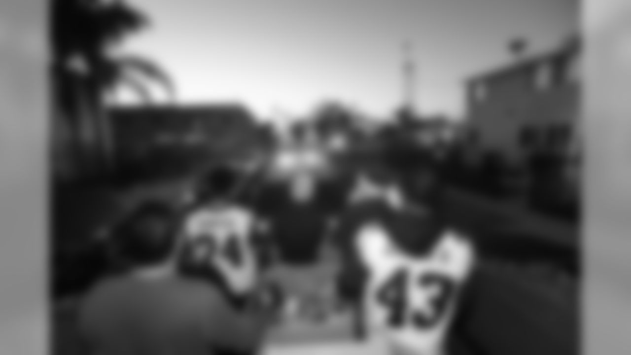 The Los Angeles Rams Community members joined by Safety (43) John Johnson III and Defensive back (24) Blake Countess team up with South LA Los Angeles Police Department to ride in Santa's Sleigh to distribute cheer and stockings of candy to local communities. Tuesday, December 11, 2018, Los Angeles, CA. (Will Navarro/Rams)