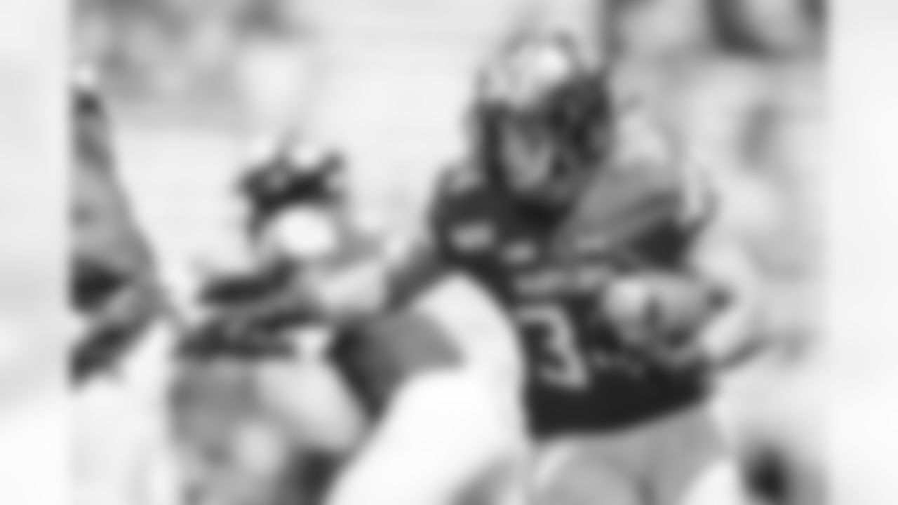 FILE - In this Aug. 31, 2019, file photo, Maryland running back Jake Funk runs with the ball against Howard during the second half of an NCAA college football game in College Park, Md. Funk and Tayon Fleet-Davis will likely receive the brunt of the carries, at least at the season's outset. Fleet-Davis, a senior, has 589 yards in offense and 10 touchdowns. Funk has 31 games of experience despite missing the final nine games in 2019 with a knee injury. Moreover, as Locksley enters his second season as the helm, he deals with quarterback Josh Jackson opting out of the 2020 season because of the COVID-19 pandemic and Tyrrell Pigrome has transferred to Western Kentucky. Alabama transfer Taulia Tagovailoa and redshirt freshman Lance Legendre have been competing for the starting spot this fall. (AP Photo/Julio Cortez, File)