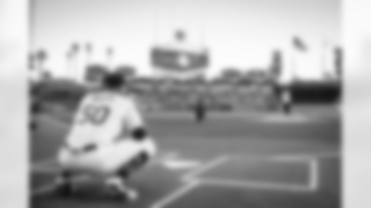 Los Angeles Rams' cornerback Jalen Ramsey throws out the first pitch at Dodgers Stadium.