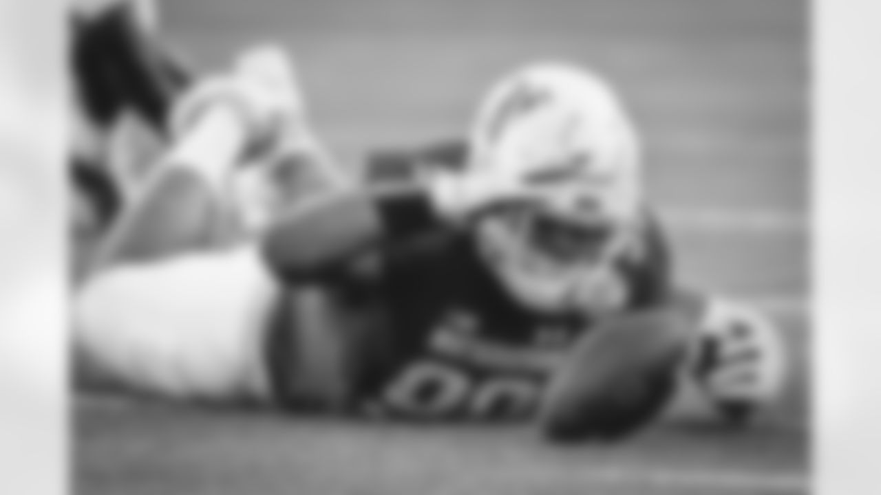 Northwestern defensive end Earnest Brown IV recovers an Auburn fumble during the second half of the Citrus Bowl NCAA college football game, Friday, Jan. 1, 2021, in Orlando, Fla. Northwestern beat Auburn 35-19. (AP Photo/John Raoux)