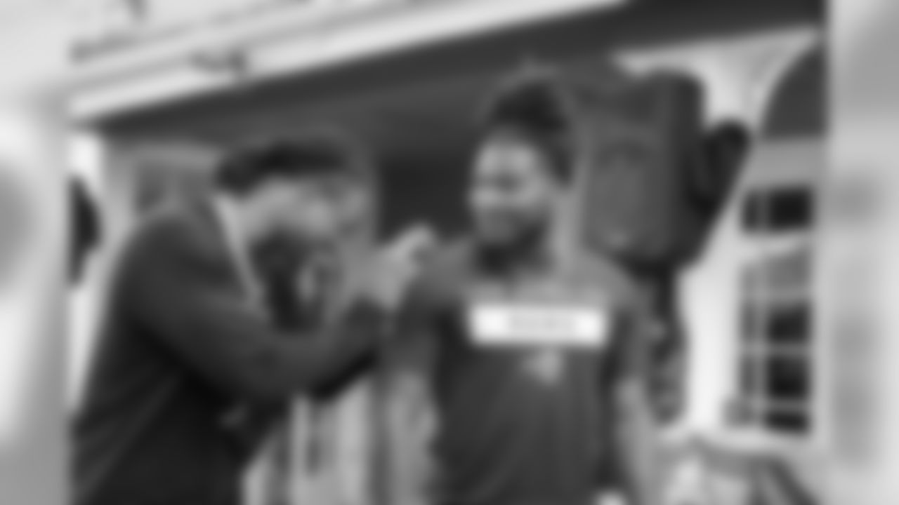 Running back (30) Todd Gurley of the Los Angeles Rams speaks to teammate (27) Darrell Henderson at a BBQ/Social at Eric Dickerson's home, Tuesday, June 11, 2019, in Calabasas, CA. (Jeff Lewis/Rams)