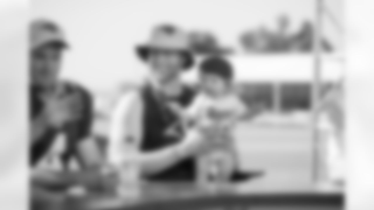 (6) Johnny Hekker and baby and (4) Greg Zuerlein of the Los Angeles Rams speak to Serina Morales on the set of Rams Training Camp Live on Day 5 of Training Camp, Monday, July 30, 2018, in Irvine, CA. (Jeff Lewis/Rams)