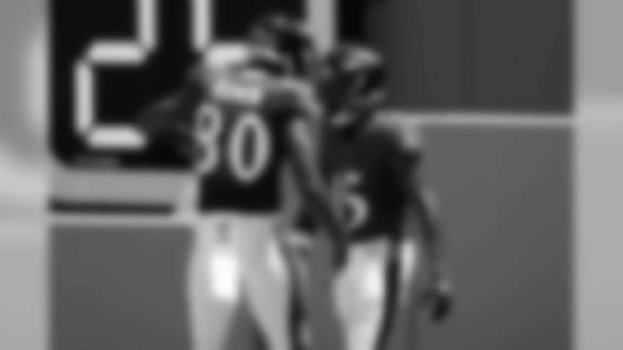 Baltimore Ravens wide receiver Miles Boykin (80) congratulates wide receiver Marquise Brown (15), after Brown scored a touchdown, during the first half at an NFL football game, Sunday, Sept. 8, 2019, in Miami Gardens, Fla. (AP Photo/Brynn Anderson)