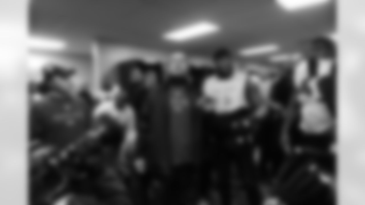The Ravens celebrate their their historic 33-14 wild card win in New England. Head Coach John Harbaugh high-fived Ravens fans around the edge of the stadium before joining his team in the locker room.
