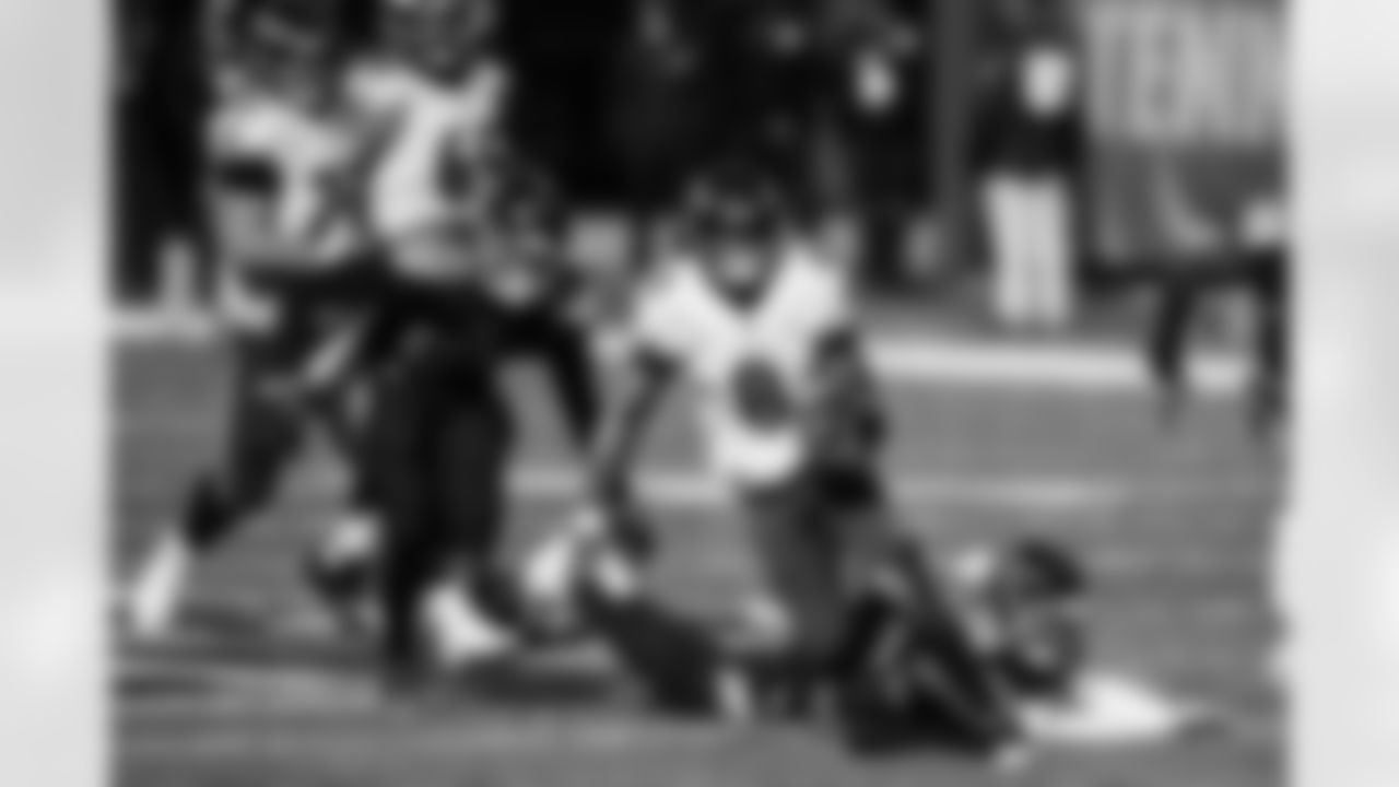 Baltimore Ravens QB Lamar Jackson (8) out runs Tennessee Titans defenders as he heads down field for a touchdown in a NFL Wild Card Playoff game on January 10, 2021 at Nissan Stadium