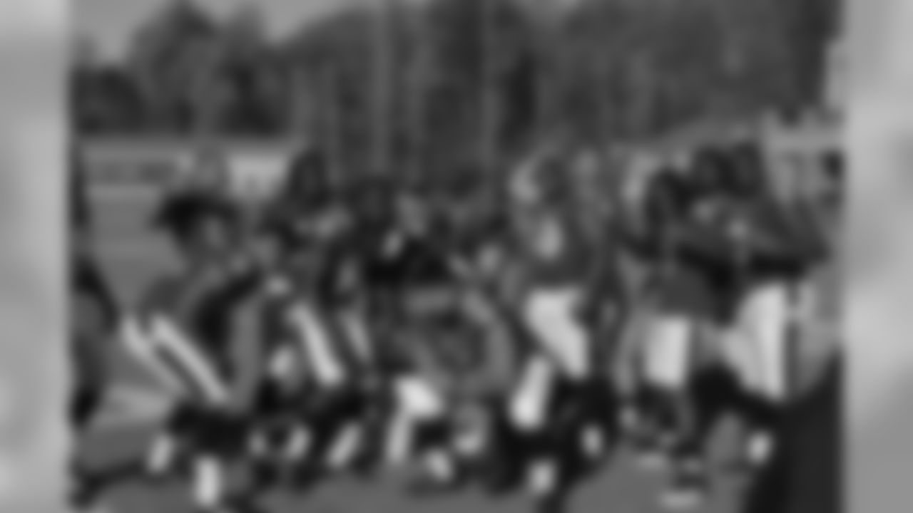 Haloti Ngata tries to crash the linebackers picture.