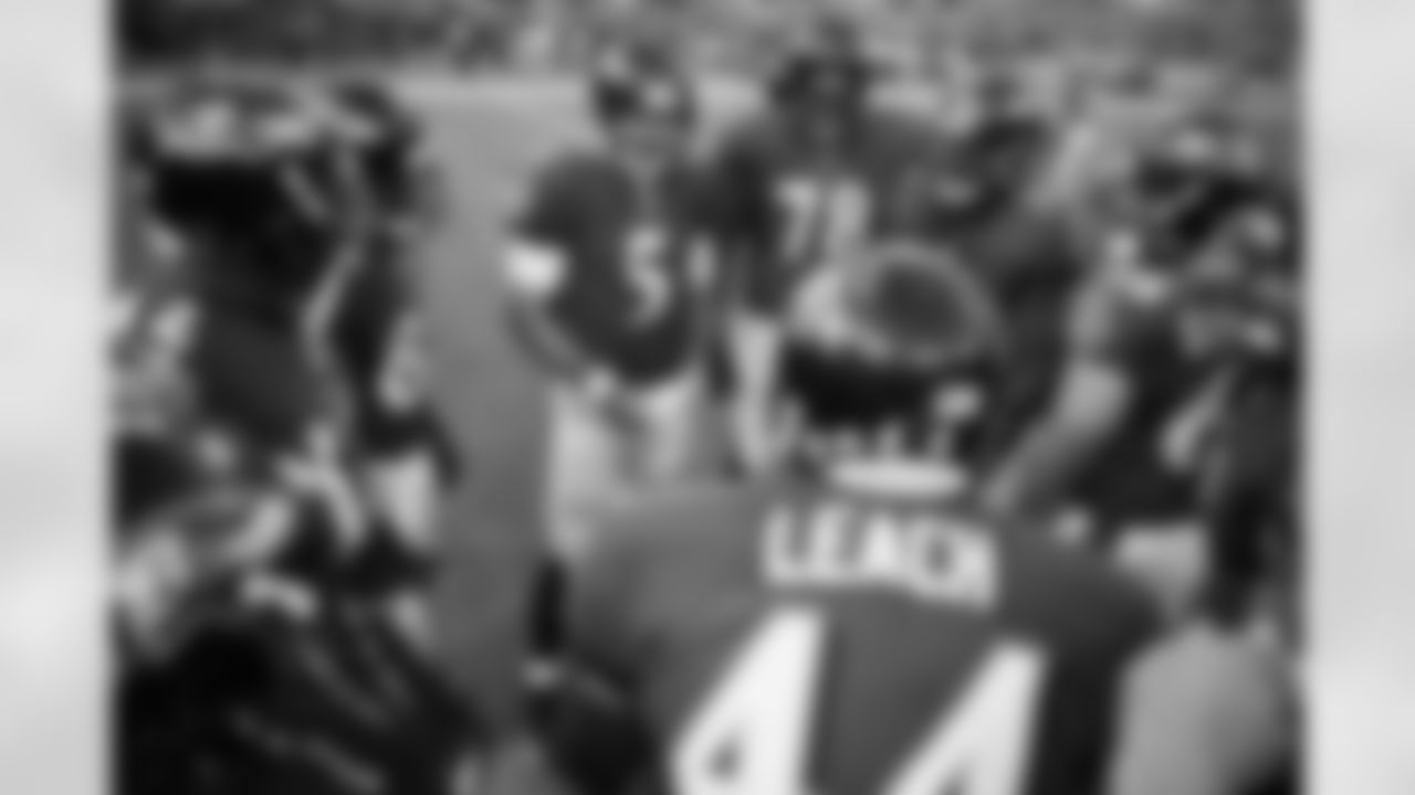 Quarterback Joe Flacco talks to his starting offense before kickoff.