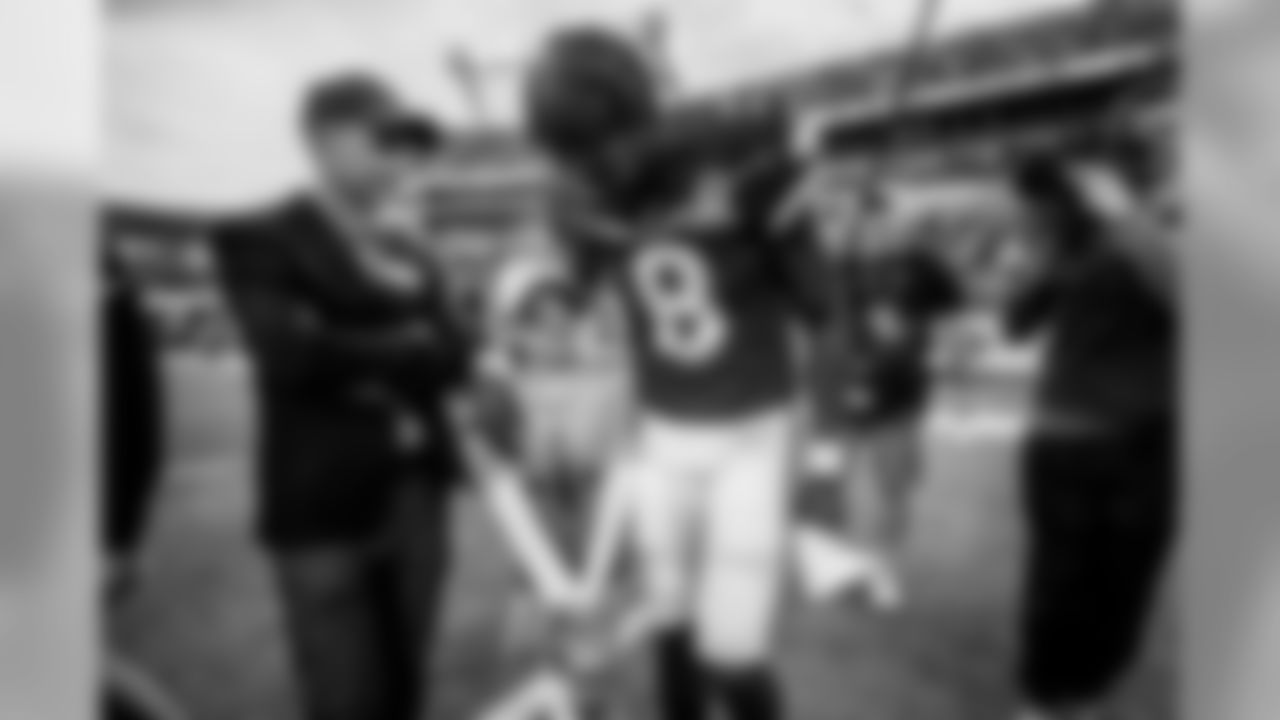 Quarterback Lamar Jackson with the son of New Orleans quarterback Drew Brees at the 2020 Pro Bowl game, Sunday, Jan. 26, 2020 in Orlando, Fla.