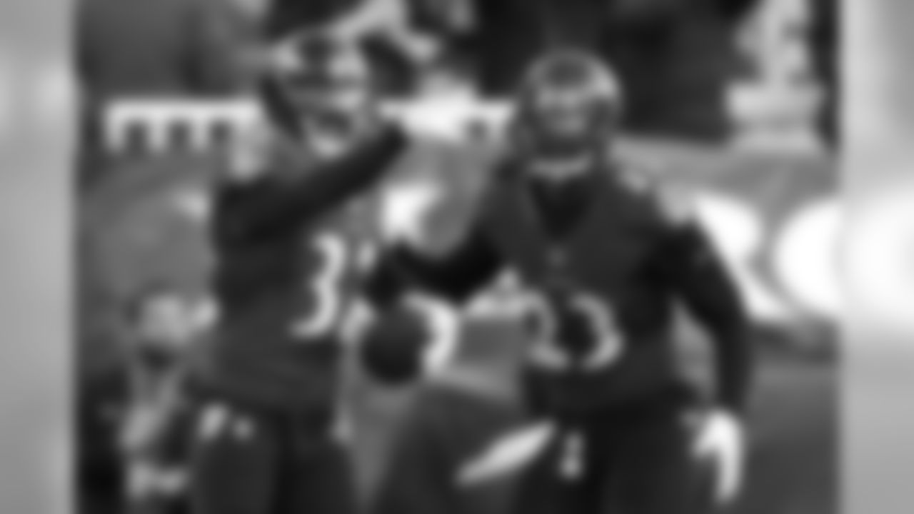 Baltimore Ravens free safety Eric Weddle, left, celebrates with teammate Tony Jefferson after running back an interception for a touchdown in the second half of an NFL football game against the Detroit Lions, Sunday, Dec. 3, 2017, in Baltimore. (AP Photo/Gail Burton)