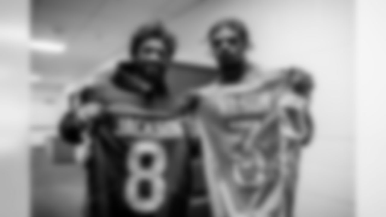 Seattle Seahawks quarterback Russell Wilson and quarterback Lamar Jackson exchange jerseys at the 2020 Pro Bowl game, Sunday, Jan. 26, 2020 in Orlando, Fla.